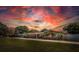 Well kept single story home with a large yard at dusk at 10611 131St St, Largo, FL 33774