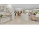 Bright, open foyer showcasing tile flooring, elegant decor, and views of the dining and living spaces at 10611 131St St, Largo, FL 33774
