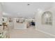 Bright, open foyer showcasing tile flooring, elegant decor, and views of the living spaces at 10611 131St St, Largo, FL 33774