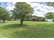 Lush green lawn leads up to this lovely single-Gathering home at 10611 131St St, Largo, FL 33774
