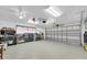 Spacious two car garage featuring epoxy flooring, a clean organized layout, and plenty of storage at 10611 131St St, Largo, FL 33774