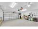 Spacious two car garage featuring epoxy flooring, a clean organized layout, and plenty of storage at 10611 131St St, Largo, FL 33774