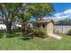 Two outdoor sheds with neutral paint and white trim, providing ample storage space and functionality at 10611 131St St, Largo, FL 33774