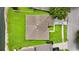An aerial shot of the home's roof and lawn, nestled in a well-maintained and green neighborhood at 10621 Ribbon Fern Way Way, Land O Lakes, FL 34638