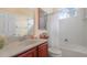 Functional bathroom with a single sink vanity and a tub-shower combination at 10621 Ribbon Fern Way Way, Land O Lakes, FL 34638