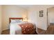 Bright bedroom showcasing a bed with decorative accents and a closet for storage at 10621 Ribbon Fern Way Way, Land O Lakes, FL 34638