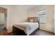 Well-lit bedroom with a cozy bed and ample natural light at 10621 Ribbon Fern Way Way, Land O Lakes, FL 34638
