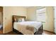 Cozy bedroom with a queen bed and accent pillows, offering a relaxing retreat at 10621 Ribbon Fern Way Way, Land O Lakes, FL 34638