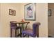 Cozy dining area with charming table, chairs, and decorative wall art at 10621 Ribbon Fern Way Way, Land O Lakes, FL 34638
