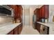 Galley style kitchen featuring stainless steel appliances, modern counters and backsplash at 10621 Ribbon Fern Way Way, Land O Lakes, FL 34638