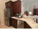 Well-appointed kitchen with stainless steel refrigerator and ample counter space at 10621 Ribbon Fern Way Way, Land O Lakes, FL 34638