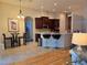 Inviting living space highlighting kitchen access, a small dining table, and comfortable seating at 10621 Ribbon Fern Way Way, Land O Lakes, FL 34638