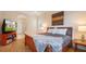 Comfortable main bedroom showcasing a wood frame bed, ensuite bathroom and stylish decor at 10621 Ribbon Fern Way Way, Land O Lakes, FL 34638