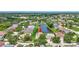 Panoramic aerial of the community, with picturesque lakes and well-spaced residences at 10734 Banfield Dr, Riverview, FL 33579