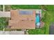 A top-down shot of the house featuring solar panels, a pool, a hot tub, and beautiful landscaping at 10734 Banfield Dr, Riverview, FL 33579