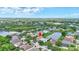 High aerial shot of home in beautiful community with lake, green space, and manicured lawns at 10734 Banfield Dr, Riverview, FL 33579