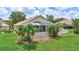 The backyard features lush lawn, a screened in patio, and plenty of space to enjoy the weather at 10734 Banfield Dr, Riverview, FL 33579