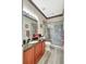 Bathroom featuring a granite vanity and glass enclosed shower at 10734 Banfield Dr, Riverview, FL 33579