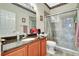Bathroom featuring a granite vanity and glass enclosed shower at 10734 Banfield Dr, Riverview, FL 33579