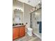 Bathroom featuring a granite vanity and glass enclosed shower at 10734 Banfield Dr, Riverview, FL 33579
