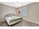 Bedroom featuring a window with plantation shutters and ceiling fan at 10734 Banfield Dr, Riverview, FL 33579
