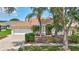 Charming single-Gathering home with a well-manicured lawn, mature trees, and attached garage at 10734 Banfield Dr, Riverview, FL 33579