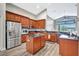 Bright eat-in kitchen features stainless appliances, granite counters, and wood cabinets at 10734 Banfield Dr, Riverview, FL 33579