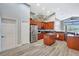 Spacious kitchen with stainless steel appliances, wooden cabinetry and an island at 10734 Banfield Dr, Riverview, FL 33579