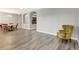 Spacious living room featuring modern hardwood floors, with views to dining area and kitchen at 10734 Banfield Dr, Riverview, FL 33579