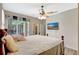 Main bedroom featuring a ceiling fan and sliding glass doors at 10734 Banfield Dr, Riverview, FL 33579