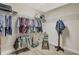Well-organized walk-in closet featuring ample shelving, hanging space, and laminate flooring at 10734 Banfield Dr, Riverview, FL 33579