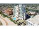 Aerial shot of an impressive condo, showcasing a pool, parking, and waterfront living at 11000 Gulf Blvd # 703, Treasure Island, FL 33706