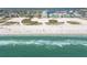 Beautiful aerial view of the crowded beach with a wide shoreline and clear blue water at 11000 Gulf Blvd # 703, Treasure Island, FL 33706