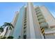 Modern condo building with beautiful blue trim and spacious balconies overlooking the neighborhood at 11000 Gulf Blvd # 703, Treasure Island, FL 33706