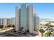 Spacious condo with blue trim, offering beach access, parking, and stunning ocean views at 11000 Gulf Blvd # 703, Treasure Island, FL 33706