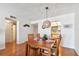 Dining room with wood table, floors, and kitchen view at 11000 Gulf Blvd # 703, Treasure Island, FL 33706