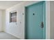 Well-maintained condo unit with a secure entry door and a glimpse of the cozy interior at 11000 Gulf Blvd # 703, Treasure Island, FL 33706