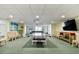 Well-equipped game room featuring a ping pong table, pool table, and ample seating at 11000 Gulf Blvd # 703, Treasure Island, FL 33706