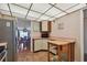 View of kitchen with tile floors, appliances, and view to the dining area at 11000 Gulf Blvd # 703, Treasure Island, FL 33706