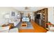 Bright living room featuring hardwood floors, ceiling fan, and a sofa at 11000 Gulf Blvd # 703, Treasure Island, FL 33706