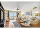 Bright living room featuring hardwood floors, ocean views, and stylish furniture at 11000 Gulf Blvd # 703, Treasure Island, FL 33706