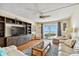 Living room featuring hardwood floors and ocean views at 11000 Gulf Blvd # 703, Treasure Island, FL 33706