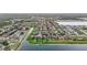 The aerial view captures the community's waterfront homes, offering tranquil lake views and manicured green spaces at 11603 Heron Watch Pl, Riverview, FL 33569