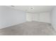 This bedroom features plush carpeting and ample closet space at 11603 Heron Watch Pl, Riverview, FL 33569