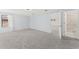 Spacious bedroom featuring plush carpeting, ample natural light, and en-suite bathroom access at 11603 Heron Watch Pl, Riverview, FL 33569