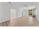 Spacious main bedroom with wood floors and ensuite bathroom access and screened patio access at 11603 Heron Watch Pl, Riverview, FL 33569