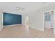 Spacious main bedroom with wood-look floors, ceiling fan, and ensuite bathroom and closet at 11603 Heron Watch Pl, Riverview, FL 33569