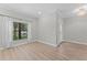 Living space featuring luxury vinyl plank flooring and front door at 11603 Heron Watch Pl, Riverview, FL 33569