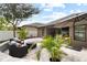 Outdoor patio featuring comfortable seating, tropical landscaping, and outdoor lighting for relaxing evenings at 12729 Flatwood Creek Dr, Gibsonton, FL 33534