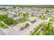 Aerial view of the community entrance, showcasing lush landscaping and well-maintained homes at 12729 Flatwood Creek Dr, Gibsonton, FL 33534